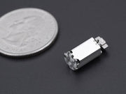 Mini vibration motor SMD side view with size comparison to a coin