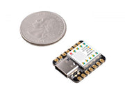 Seeeduino XIAO SAMD21 Arduino Microcontroller top view with size comparison to a coin